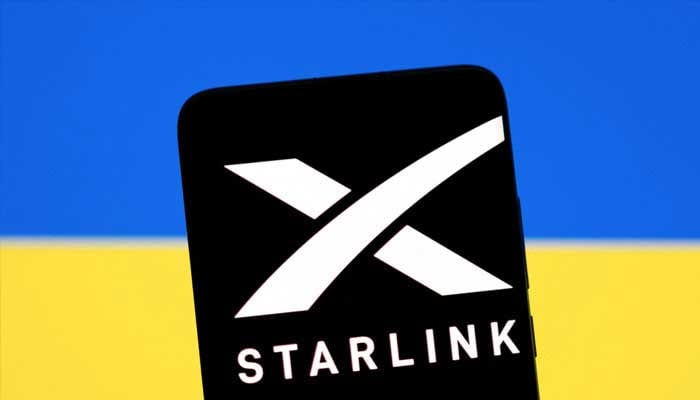 Starlink logo is seen on a smartphone in front of displayed Ukrainian flag in this illustration taken February 27, 2022. — Reuters