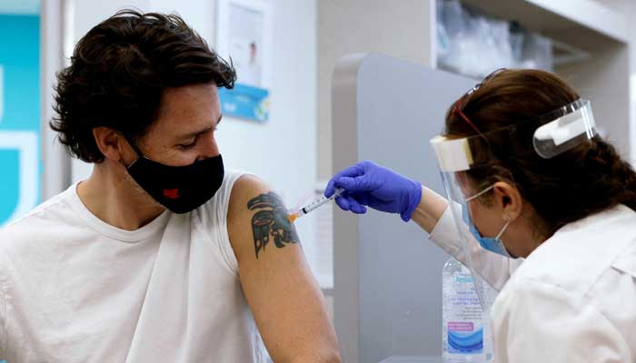 Canadas Prime Minister Justin Trudeau is inoculated with AstraZenecas vaccine against coronavirus disease (COVID-19) at a pharmacy in Ottawa, Ontario, Canada April 23, 2021. — Reuters