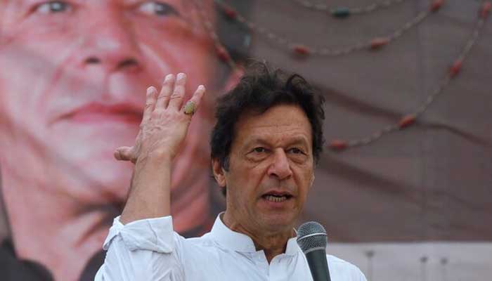 Imran Khan, founder of the Pakistan Tehreek-e-Insaf (PTI), gestures while addressing his supporters during a campaign meeting ahead of general elections in Karachi, Pakistan, July 4, 2018. — Reuters