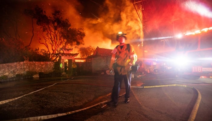 Firefighters battle the Palisades fire as it burns during a windstorm on the west side of Los Angeles, California, US, on January 8, 2025. — Reuters