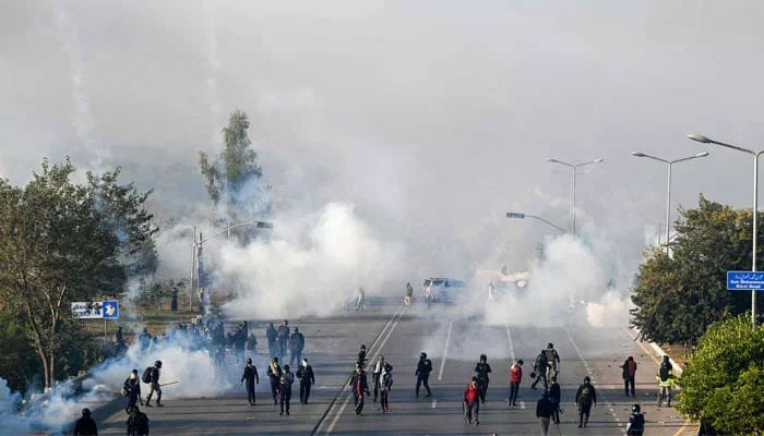 Policemen fire tear gas shells to disperse supporters of Pakistan Tehreek-e-Insaf (PTI) during a protest to demand the release of former prime minister Imran Khan, in Islamabad on November 26, 2024. — AFP