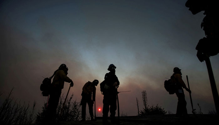 Firefighters battle the fire in the Angeles National Forest near Mt Wilson as the wildfires burn in the Los Angeles area, during the Eaton Fire in Altadena, California, US January 9, 2025.  — Reuters