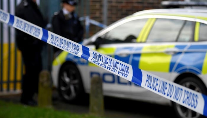 Police officers stand outside the scene of a crime in Croydon, London, Britain, February 6, 2021. — Reuters