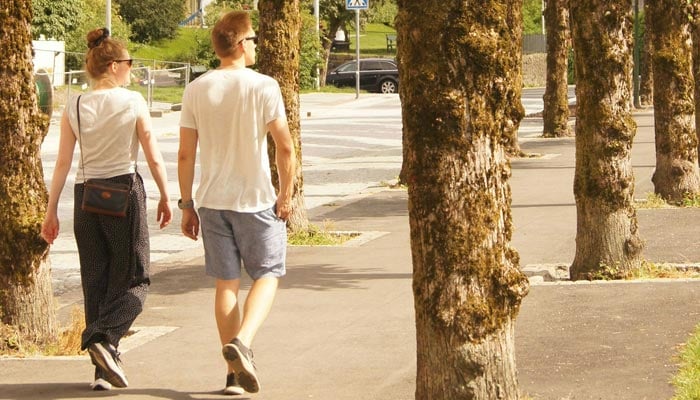 This is a representational image of people taking a walk. — Unsplash