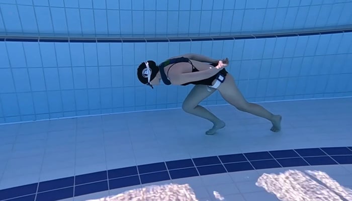 Australian diver Amber Bourke pictured during her walk along the bottom of the pool. — Guinness World Records/File