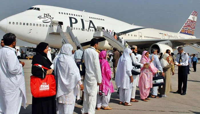 The representational image shows Pakistani pilgrims waiting in line as they prepare to board a the PIA special Haj pilgrimage flight bound for Saudi Arabia at an Airport in Pakistan. — AFP/File