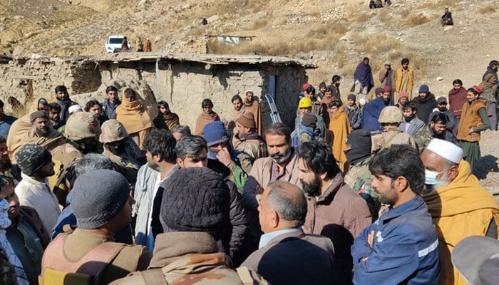 Miners gathered outside a coal mine while rescue personnel search for workers trapped after a gas explosion in this image  released by the Balochistan Mining Department on January 10, 2024. — Mining Department Balochistan