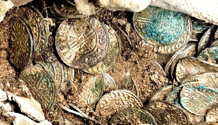 A close-up of silver coins excavated at the Sizewell C construction site. — Oxford Cotswold Archaeology/File