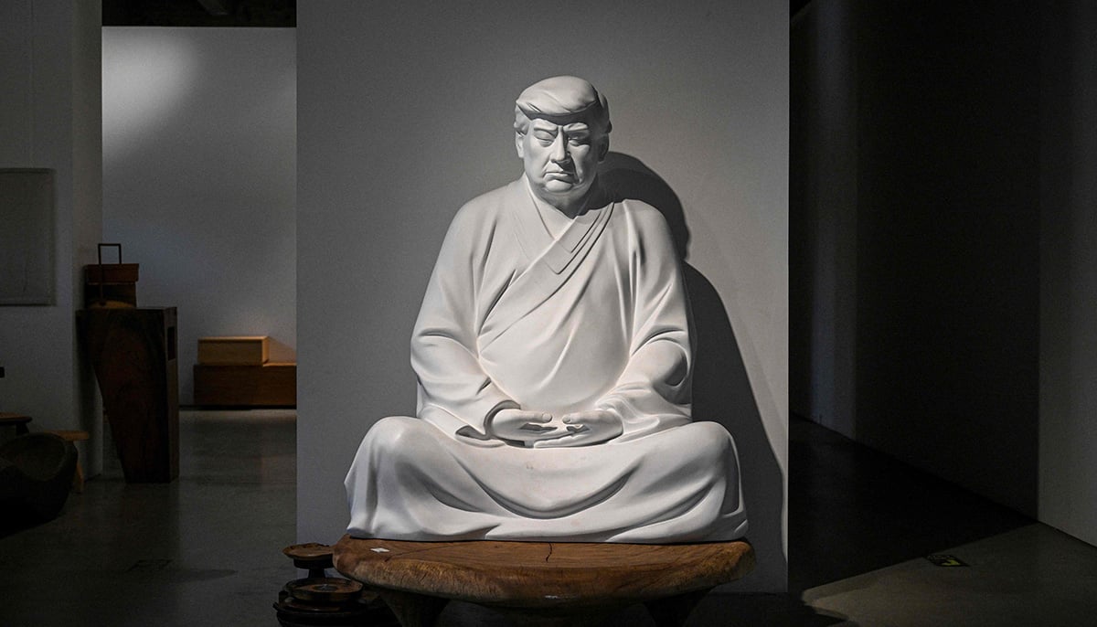 This photo taken on December 9, 2024 shows a sculpture of US president-elect Donald Trump in a pose evoking the Buddha at artist Hong Jinshis workshop in Xiamen, in southeastern Chinas Fujian province. — AFP