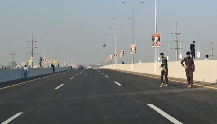 Youngsters can be seen playing cricket on the Malir Expressway on January 12, 2025. — Reporter