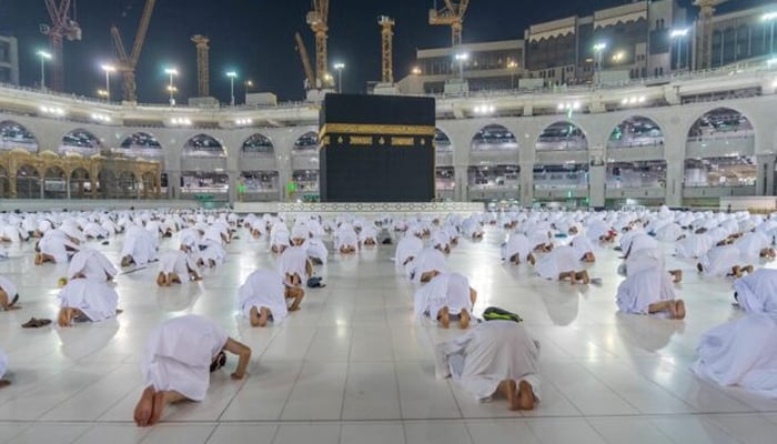 Muslims, keeping a safe social distance, pray as they perform Umrah at the Kaaba after Saudi authorities ease the COVID-19 restrictions, in the holy city of Makkah, Saudi Arabia, November 1, 2020. — Reuters