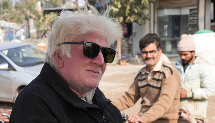 Saleem Bagga, seen by some as a lookalike of US President-elect Donald Trump, poses for a photograph while selling kheer, a traditional South Asian rice pudding, along a road in Sahiwal, Pakistan January 13, 2025. — Reuters