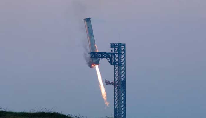 SpaceXs Super Heavy booster lands during SpaceX Starships fifth flight test, in Boca Chica, Texas, US, October 13, 2024. — Reuters