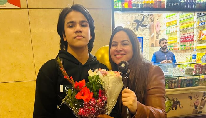 Pakistani youngster Shehram Wasi poses for a picture with his mother.