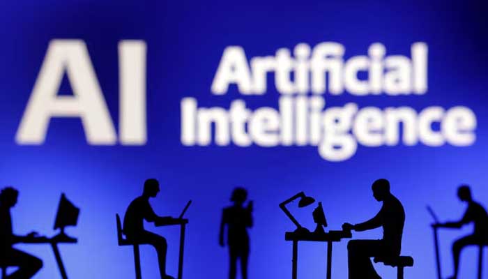 Figurines with computers and smartphones are seen in front of the words Artificial Intelligence AI in this illustration taken, February 19, 2024. — Reuters