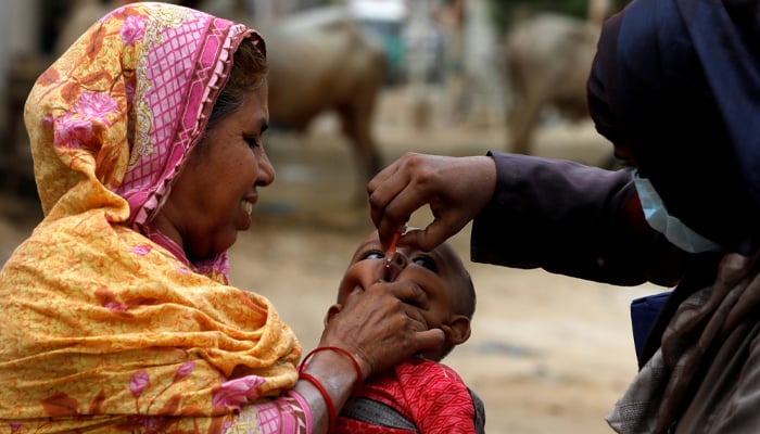 A boy receives polio vaccine drops, during an anti-polio campaign, in a low-income neighborhood as the spread of the coronavirus disease (COVID-19) continues, in Karachi, Pakistan July 20, 2020. — Reuters