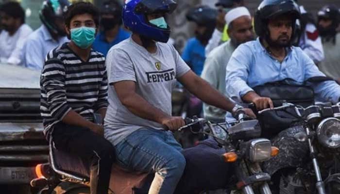 A representational image showing people riding motorcycles. — AFP/File