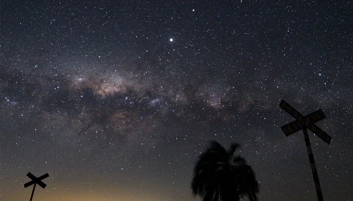 The Milky Ways Galactic Center and Jupiter (brightest spot at center top) are seen from near Reboledo, department of Florida, Uruguay, early on August 24, 2020. — AFP