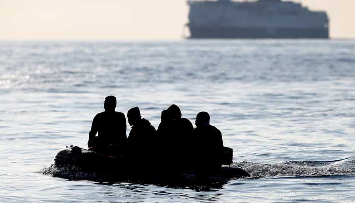 Migrants claiming to be from Darfur, Sudan cross the English Channel in an inflatable boat near Dover, Britain, August 4, 2021. — Reuters