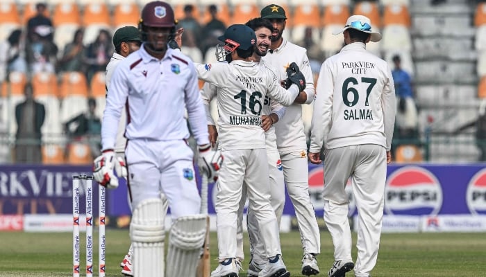 Abrar Ahmed (centre) celebrates with his teammates after taking the wicket of West Indies Tevin Imlach (left) during the third day of the first Test between Pakistan and West Indies at Multan Cricket Stadium in Multan on January 19, 2025. — AFP