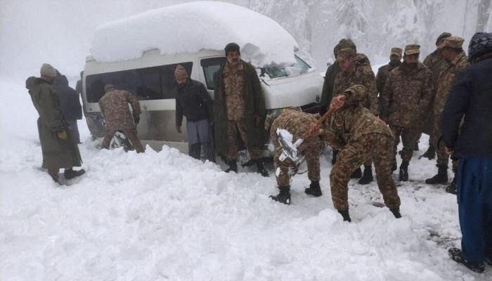 Representational image shows soldiers clearing snow from a road after a heavy snowfall in Murree. — AFP/File