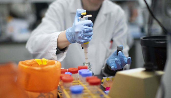 In this file photo, a researcher works in a lab that is developing testing for the Covid-19 coronavirus in Nutley. — AFP/File