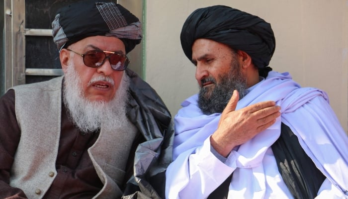 (From left) Sher Mohammad Abbas Stanekzai, Afghanistans deputy foreign minister for political affairs, speaks with countrys deputy Prime Minister Abdul Ghani Baradar during a graduation ceremony of madrassas in Khost, Afghanistan on January 18, 2025. — AFP