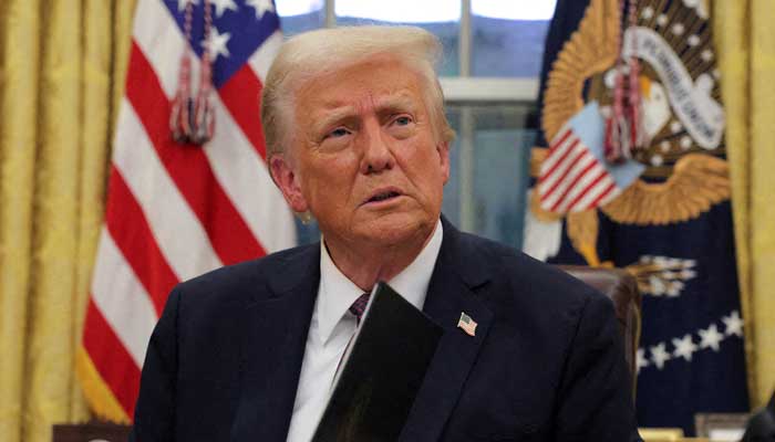 US President Donald Trump signs documents as he issues executive orders and pardons for January 6 defendants in the Oval Office at the White House on Inauguration Day in Washington, US, January 20, 2025. — Reuters