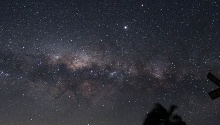 The Milky Ways Galactic Center and Jupiter (brightest spot at center top) are seen from near Reboledo, department of Florida, Uruguay, early on August 24, 2020. — AFP