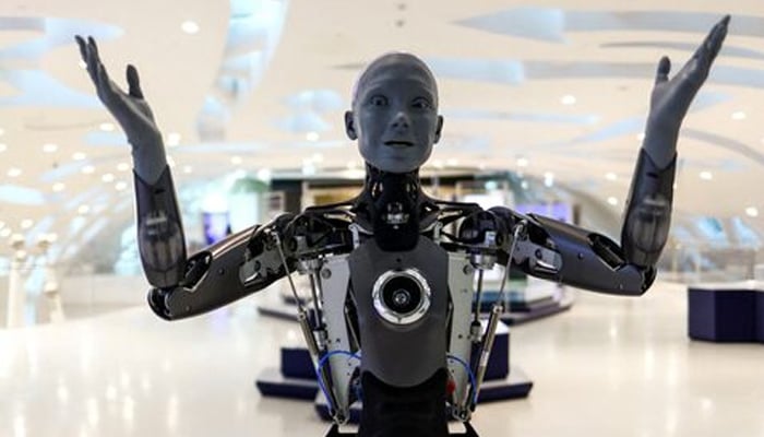 A humanoid robot staff greets visitors at an exhibition in Dubais Museum of the Future, United Arab Emirates. — Reuters