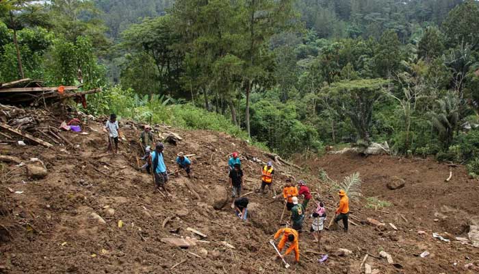 Indonesian rescue members with residents evacuated people from the site of a landslide triggered by high-intensity rains, that affected two villages in Tana Toraja, South Sulawesi province, Indonesia, April 15, 2024. — Reuters