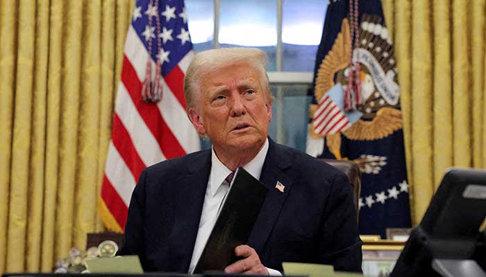 US President Donald Trump signs documents as he issues executive orders and pardons for January 6 defendants in the Oval Office at the White House on Inauguration Day in Washington, US, January 20, 2025. — Reuters