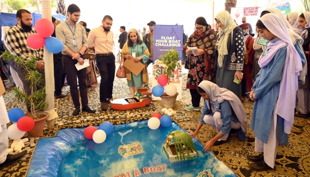 Ukasha Kharbey (left) and Hamza Khalid from the process and brand teams at Reckitt, Dr Amtul Qayoom, associate professor of Chemistry at NED-UET,  Dr Sofia Qaisar, senior scientific officer at PCSIR load-testing projects for the Float your Boat challenge. — Photo via author