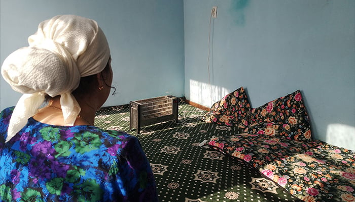 This picture taken on December 3, 2024 shows Gulbakhor, a 42-year-old housewife, attending a fortune telling session on the outskirts of Dushanbe. — AFP