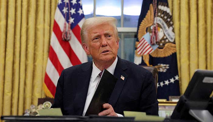 US President Donald Trump signs documents as he issues executive orders and pardons for January 6 defendants in the Oval Office at the White House on Inauguration Day in Washington, US, January 20, 2025. — Reuters