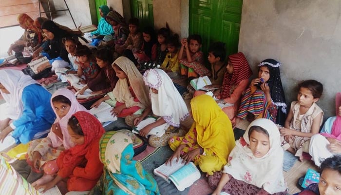 Young girls engage in a study session at a non-formal school. — Literacy.punjab.gov.pk