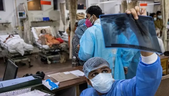 A doctor looks at an X-ray at a hospital in New Delhi, India, in this file photo. — Reuters