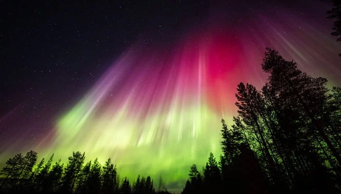 Picture taken on late March 23, 2023, shows colourful northern lights (Aurora borealis) appearing around the Arctic Circle near Rovaniemi, Finland. — AFP