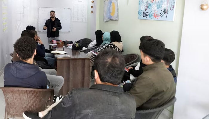 Afghan citizens attend English class near Islamabad on January 22, 2025. — Reuters