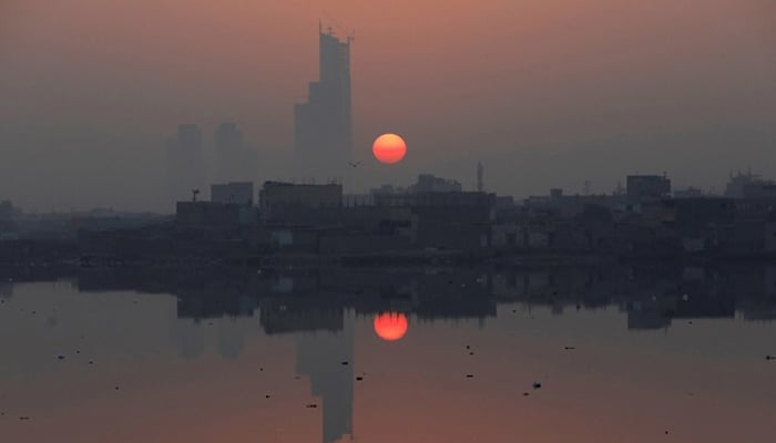 Sun reflected in water at the China Creek area in Karachi. — Reuters/File