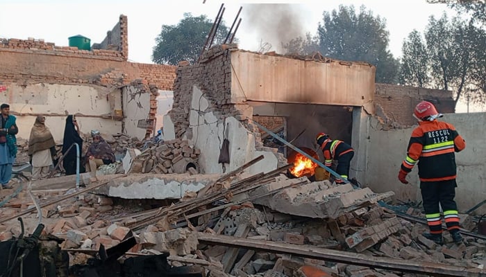 Firefighters pictured during the fire extinguishing operation at the Industrial Estate in Multan on January 27, 2024, in this still taken from a video. — Geo News/Jowdut Nadeem