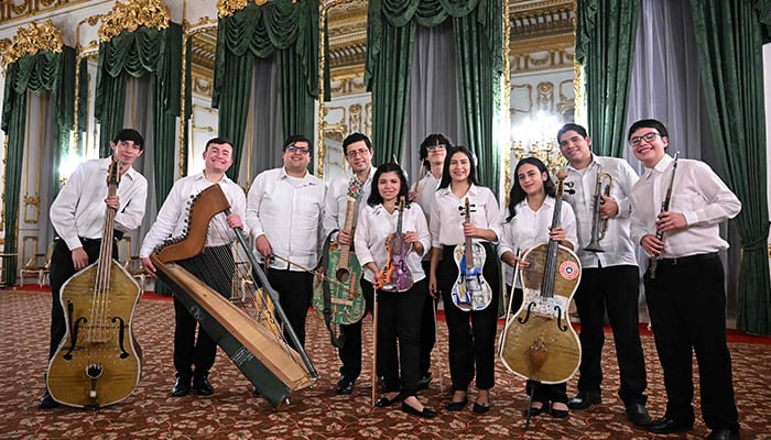 Members of the Paraguayan Recycled Orchestra of Cateura pose for a photograph before they perform for an audience inside Lancaster House in London on January 26, 2025. — AFP