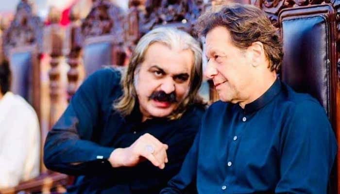 This image shows the Pakistan Tehreek-e-Insaf (PTI) founder Imran Khan (right) along with KP CM Amin Gandapur. — AFP/File