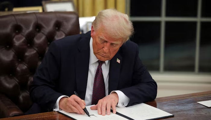 US President Donald Trump signs documents as he issues executive orders in the Oval Office at the White House on Inauguration Day in Washington, US on January 20, 2025. — Reuters