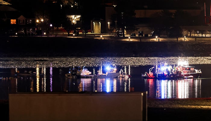 Emergency personnel and divers work next to parts of the wreckage of the American Eagle flight 5342, after it collided with a Black Hawk helicopter while approaching Reagan Washington National Airport and crashed into the Potomac River, outside Washington, US, January 30, 2025. — Reuters