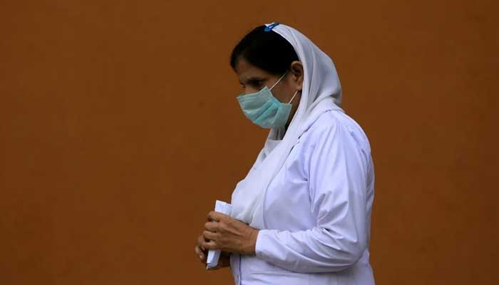 A nurse wears a face mask at the Lady Reading Hospital in Peshawar. — Reuters/File