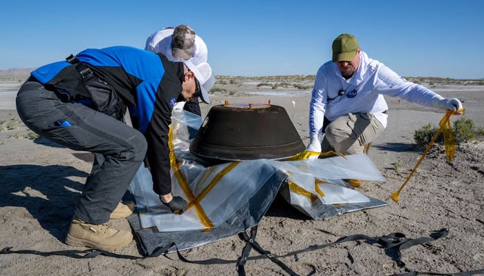 The return capsule containing a sample collected from the asteroid Bennu in October 2020 by Nasas OSIRIS-REx spacecraft is seen shortly after touching down in the desert at the Department of Defenses Utah Test and Training Range in Dugway, Utah, US on September 24, 2023. — Reuters