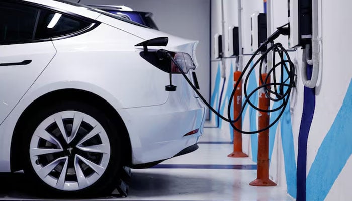 An electric vehicle is plugged into a charging station in Bilbao, Spain, February 15, 2023. — Reuters