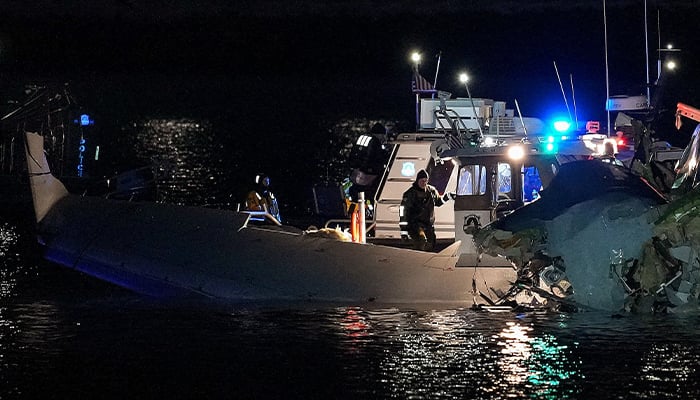 Emergency response units assess airplane wreckage in the Potomac River near Ronald Reagan Washington Airport on January 30, 2025 in Arlington, Virginia. — AFP