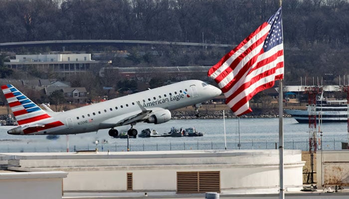 Search and rescue teams work in the aftermath of the collision of American Eagle flight 5342 and a Black Hawk helicopter that crashed into the Potomac River, with the Capitol dome in the background, as seen from Virginia, US, January 30, 2025. — Reuters